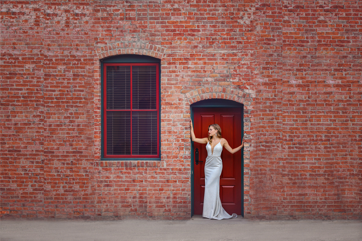 bride and brick wall